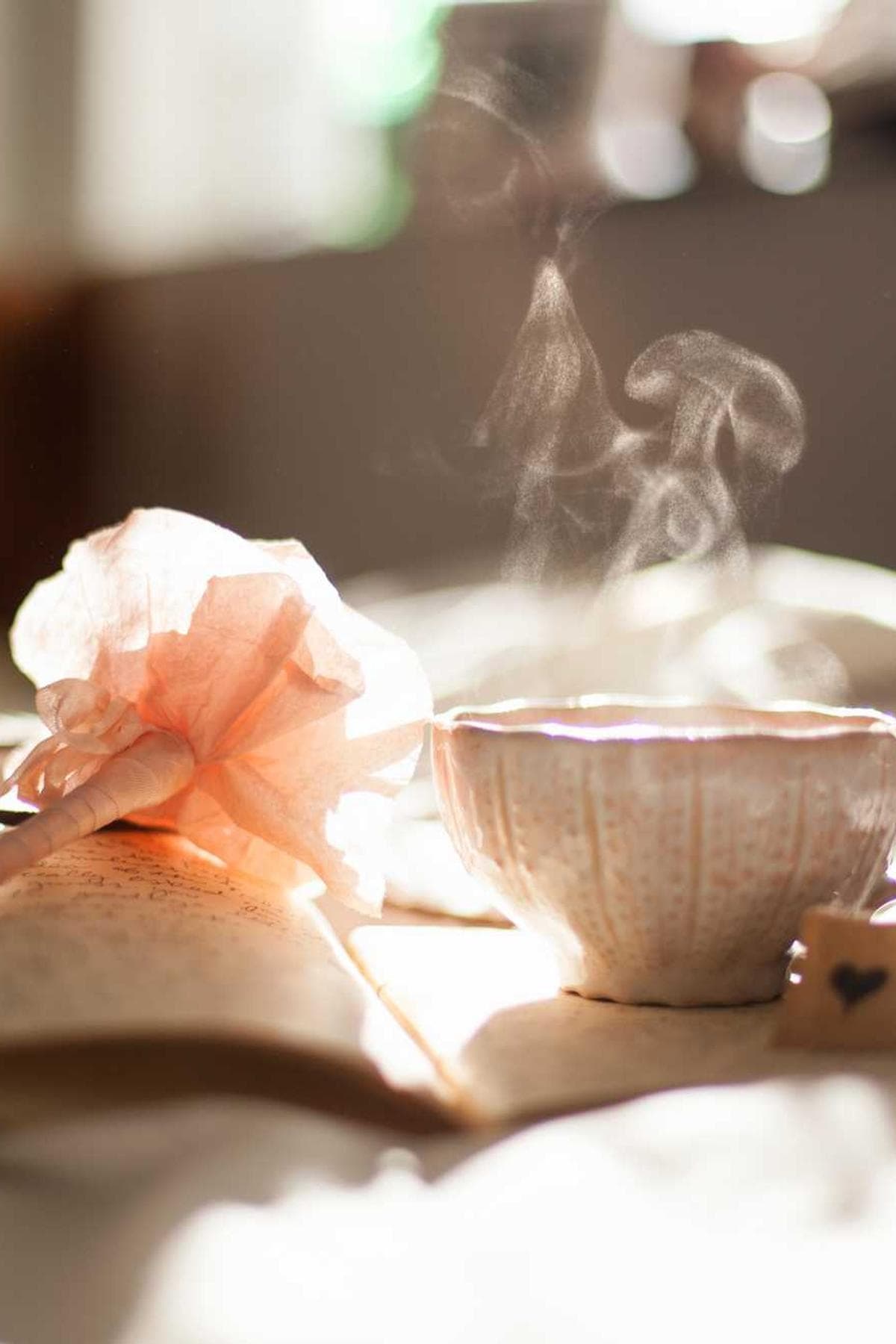 A beautiful high-rise building with a modern architectural design, viewed from a low angle against a clear blue sky.